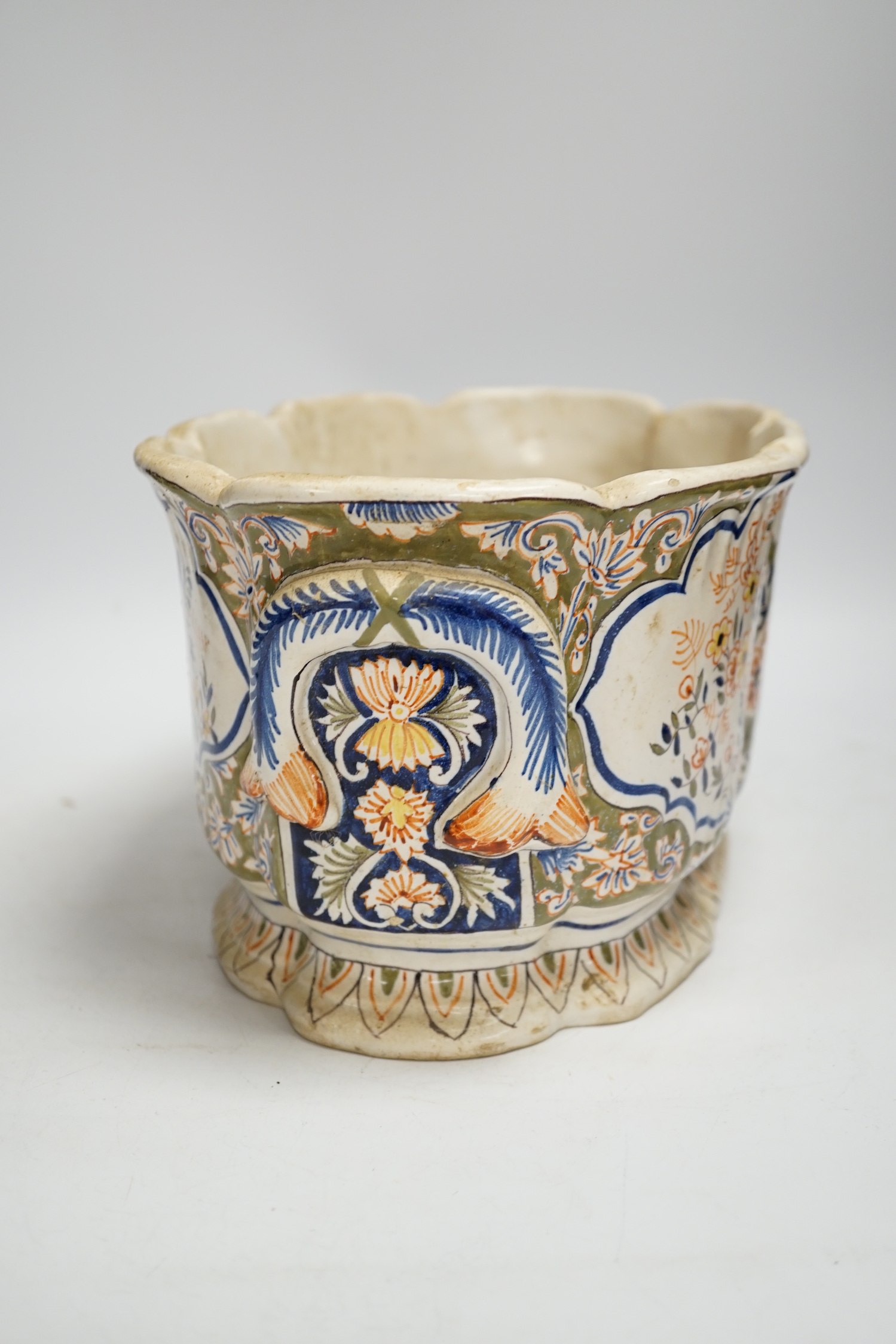 A Two French faience pottery planters, one with armorial crest and another, longer 34cm (2)